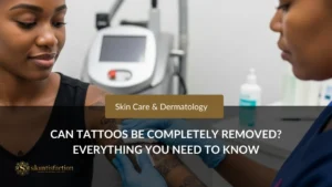 Can Tattoos Be Completely Removed? Dermatology clinic consultation for tattoo removal with a confident woman and professional attending to her arm.