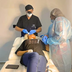 Modern Dental Clinic With Professionals Providing Safe, Comfortable Treatment In A Sterile, Well-Lit Environment. Dental Professionals Perform Safe, Modern Cosmetic Or Dental Treatment In A Sterile, Well-Lit Clinic.